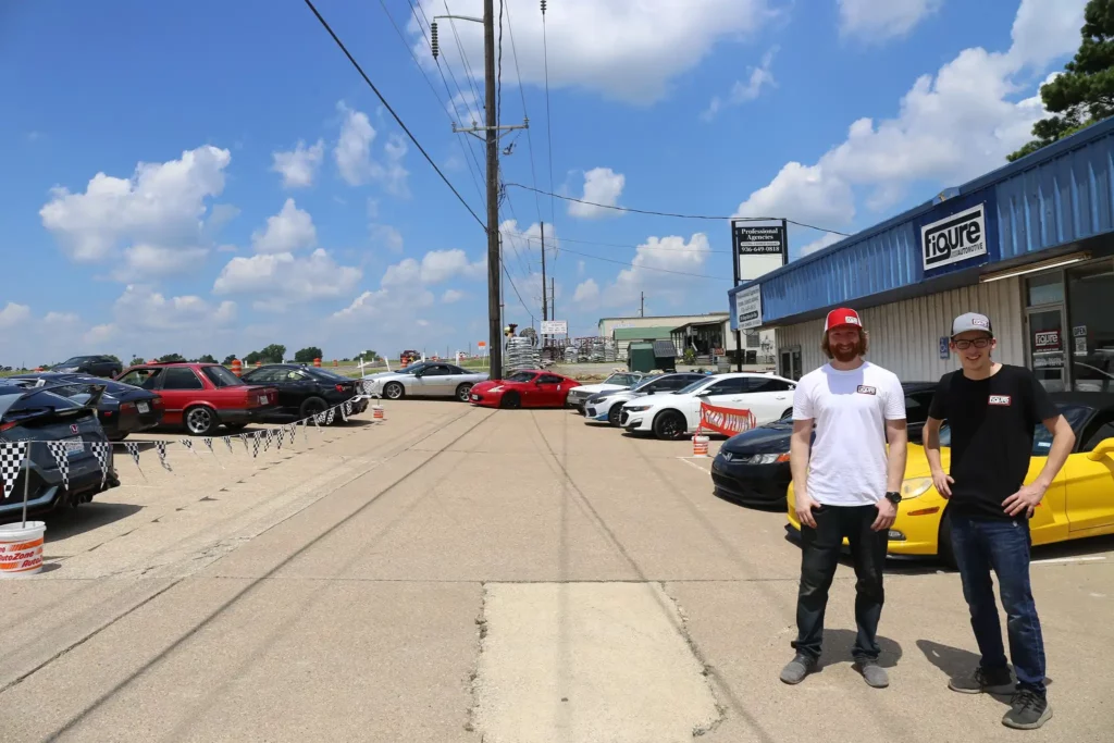 Outside and parking lot of Figure Automotive in Huntsville, TX About US