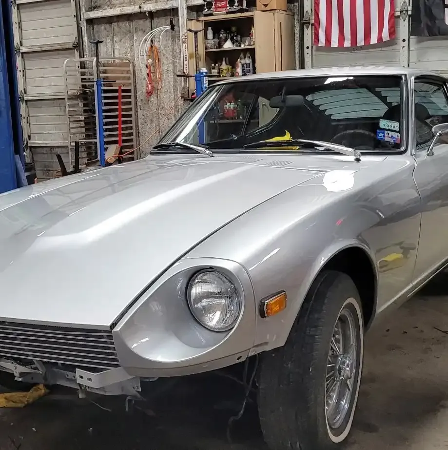 Silver Datsun Z car in the Figure Automotive shop