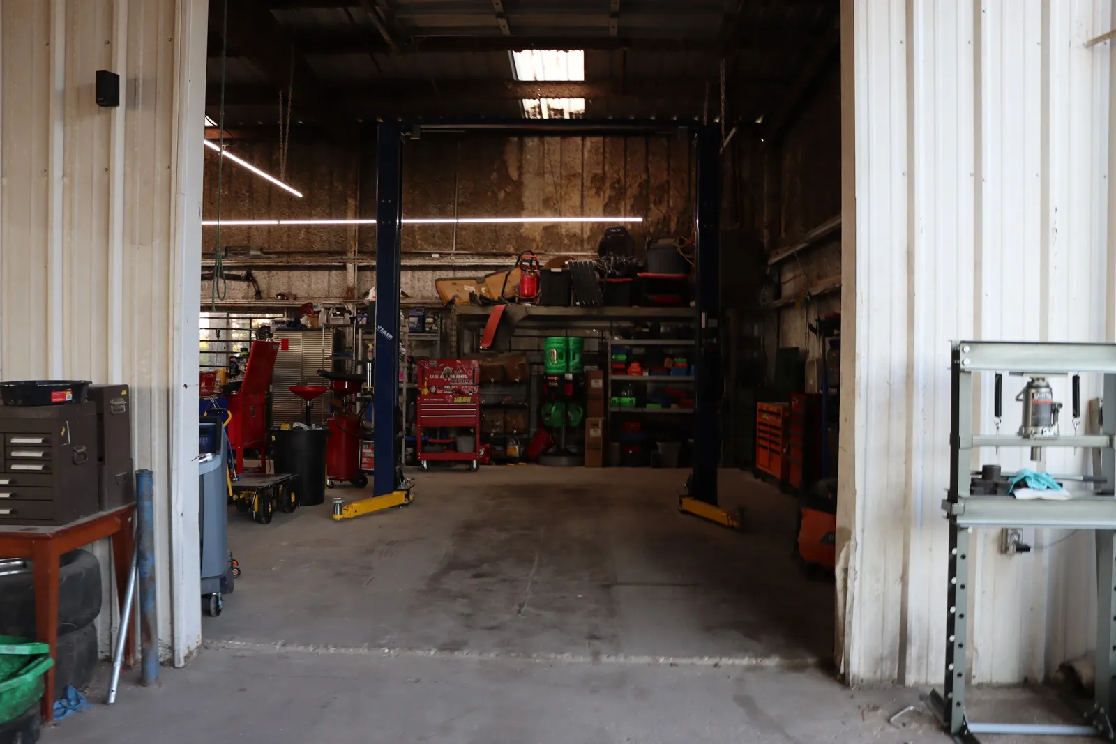 Service bays and lifts inside the Figure Automotive shop in Huntsville