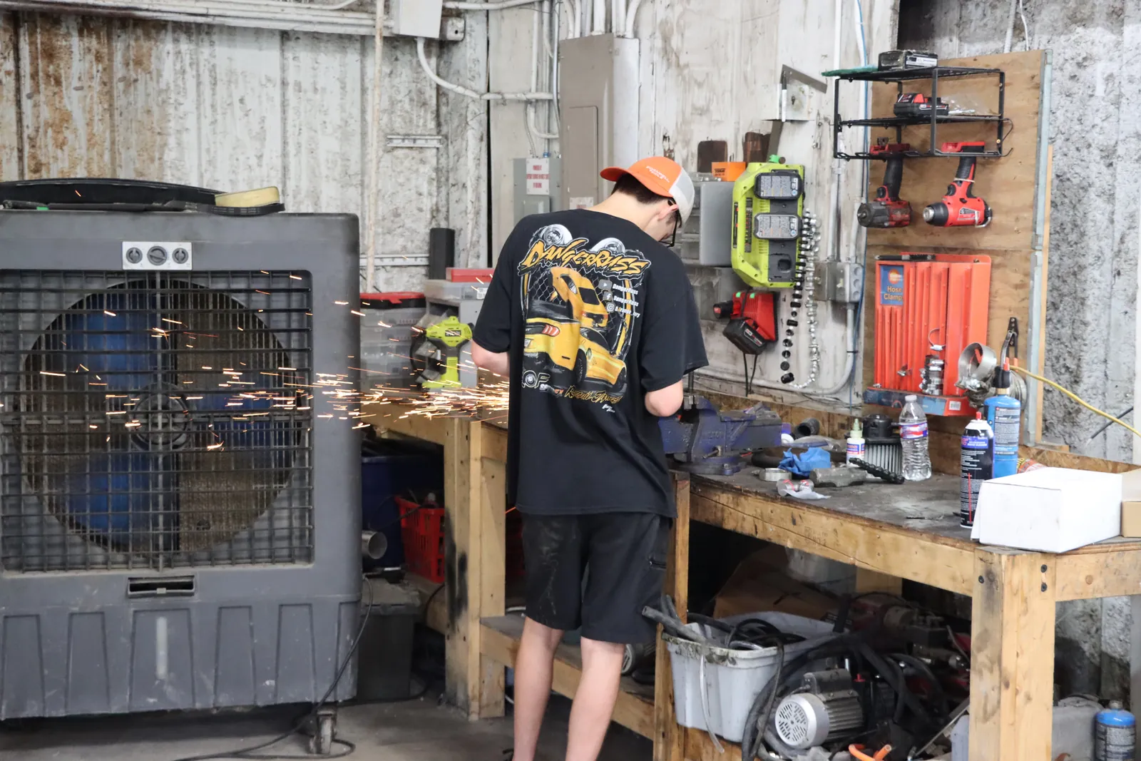 Sparks from a grinder at the Figure Automotive workbench