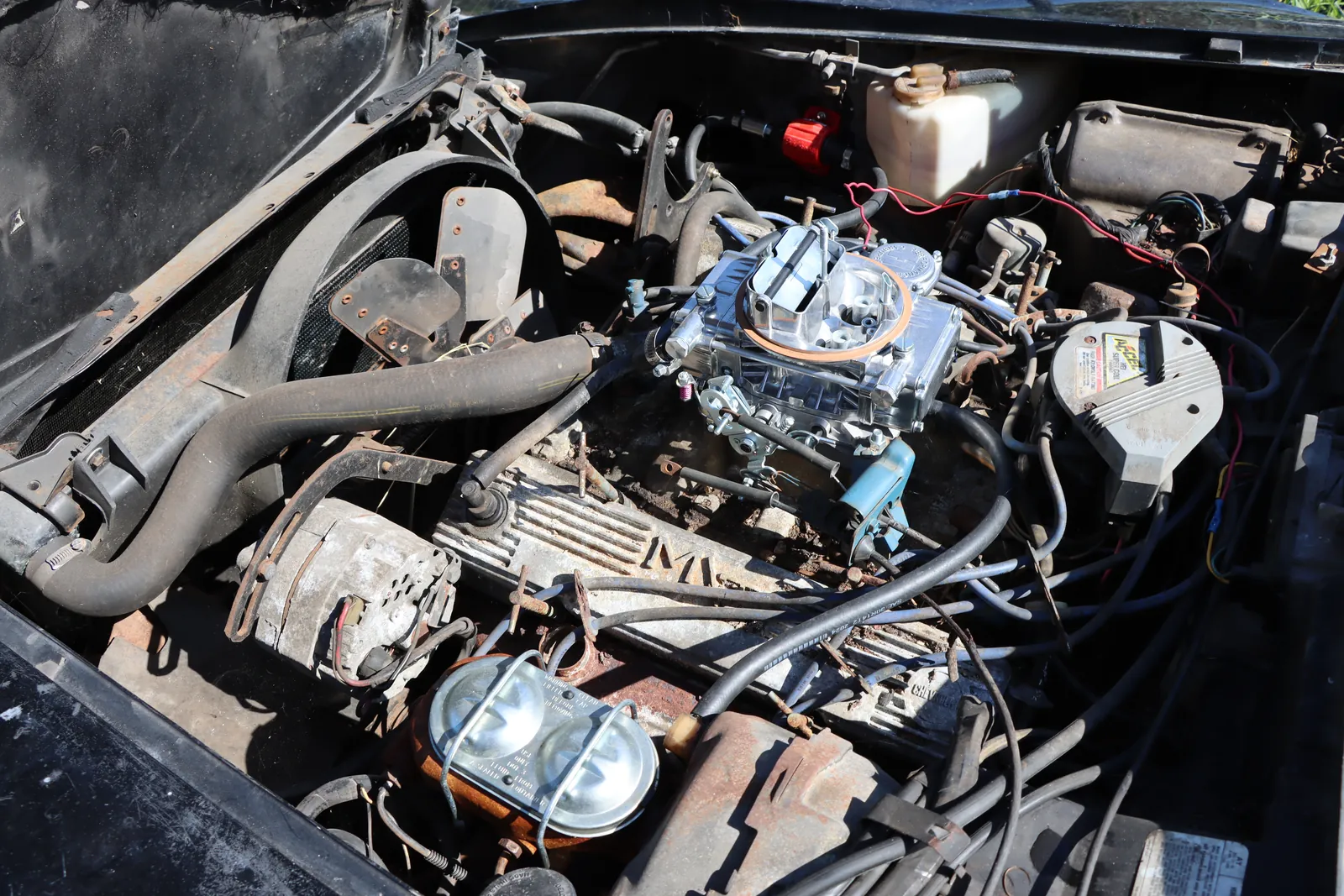 Carbureted V8 in a classic Corvette engine bay at Figure Automotive