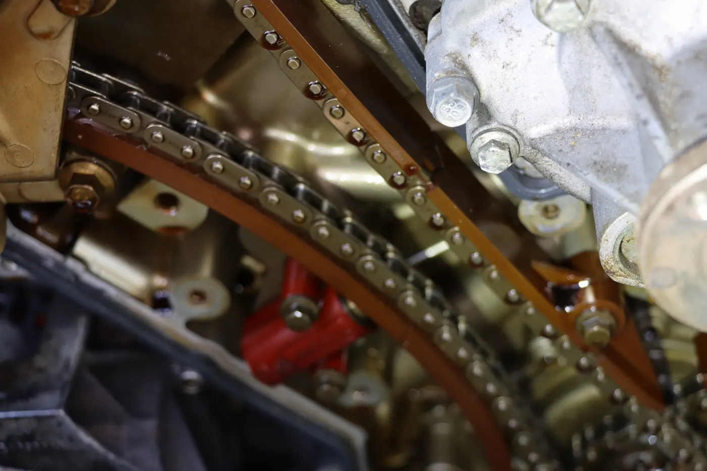 Timing chains and guides on an engine during repair