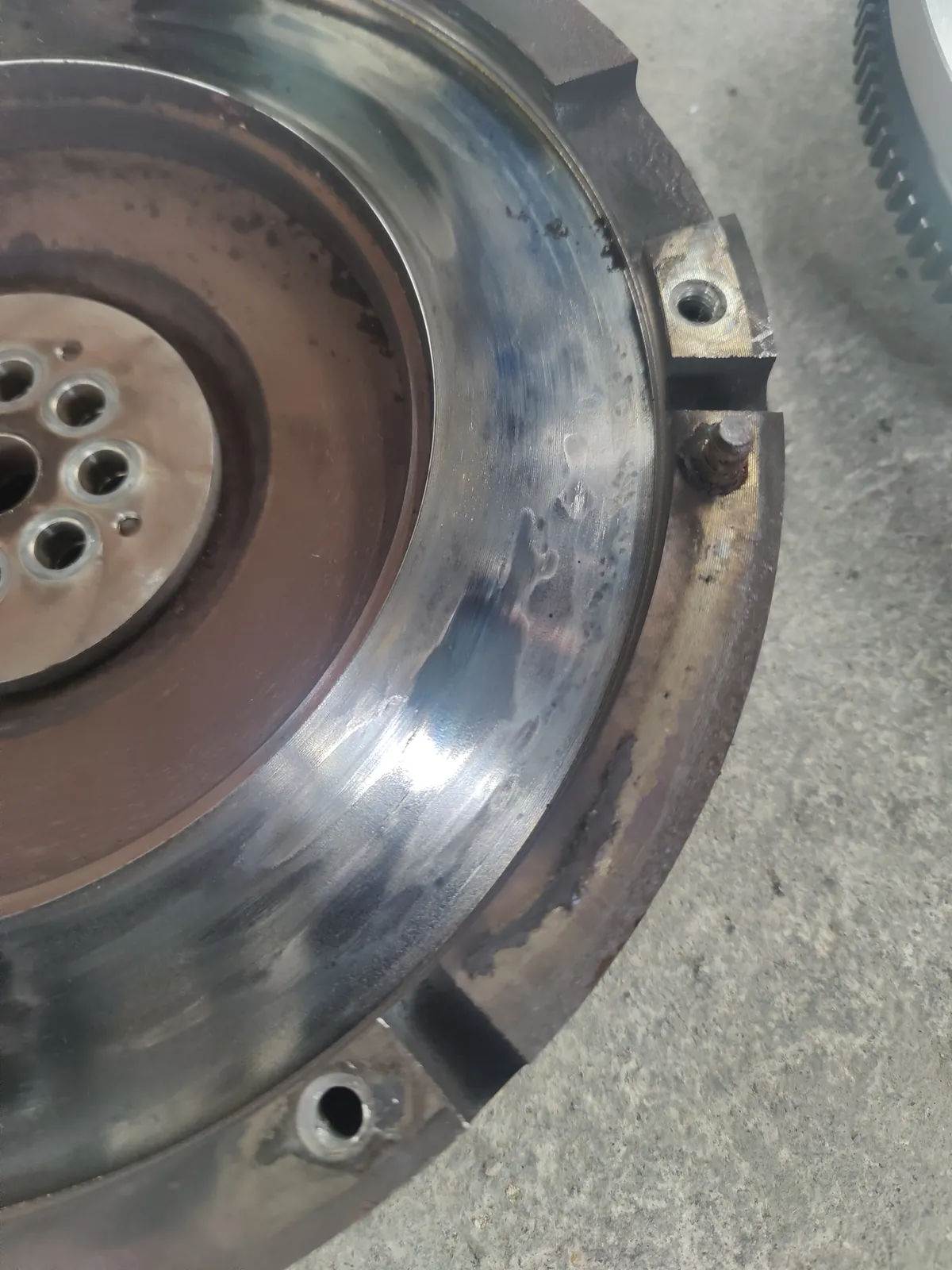 Flywheel friction surface inspected during a clutch job