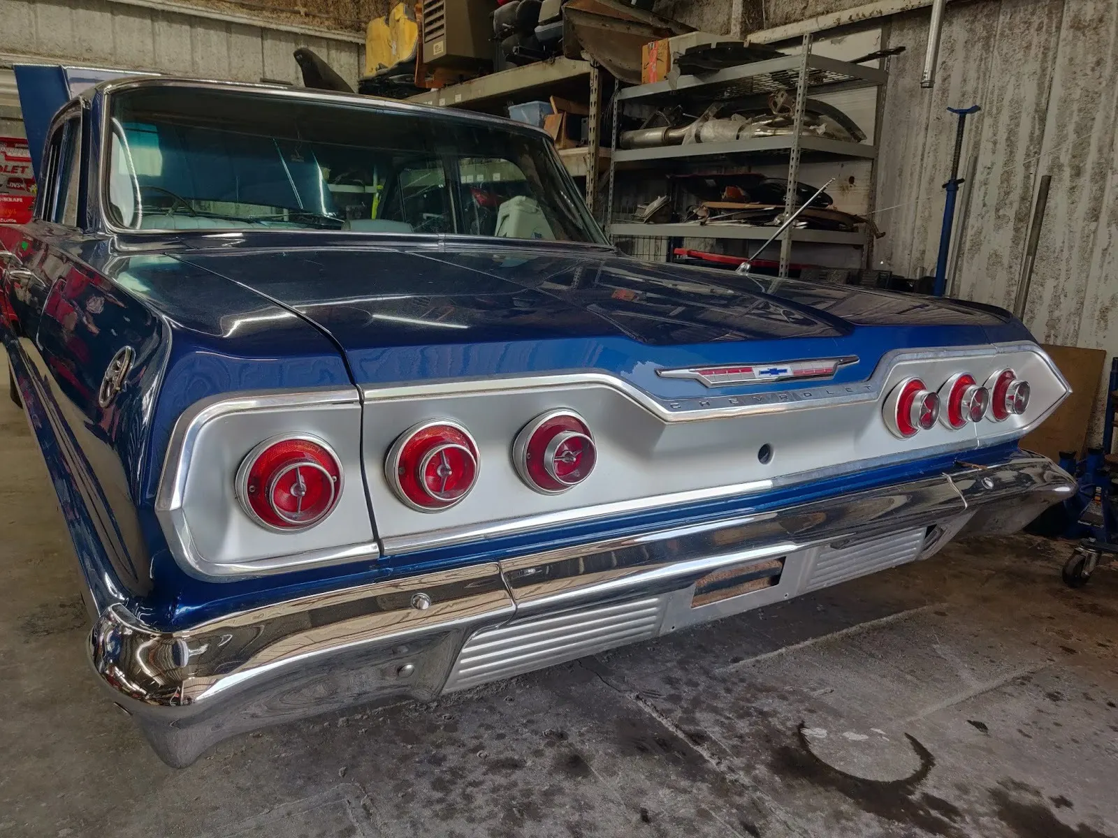 Rear of a blue 1963 Chevrolet Impala with its triple round tail lights