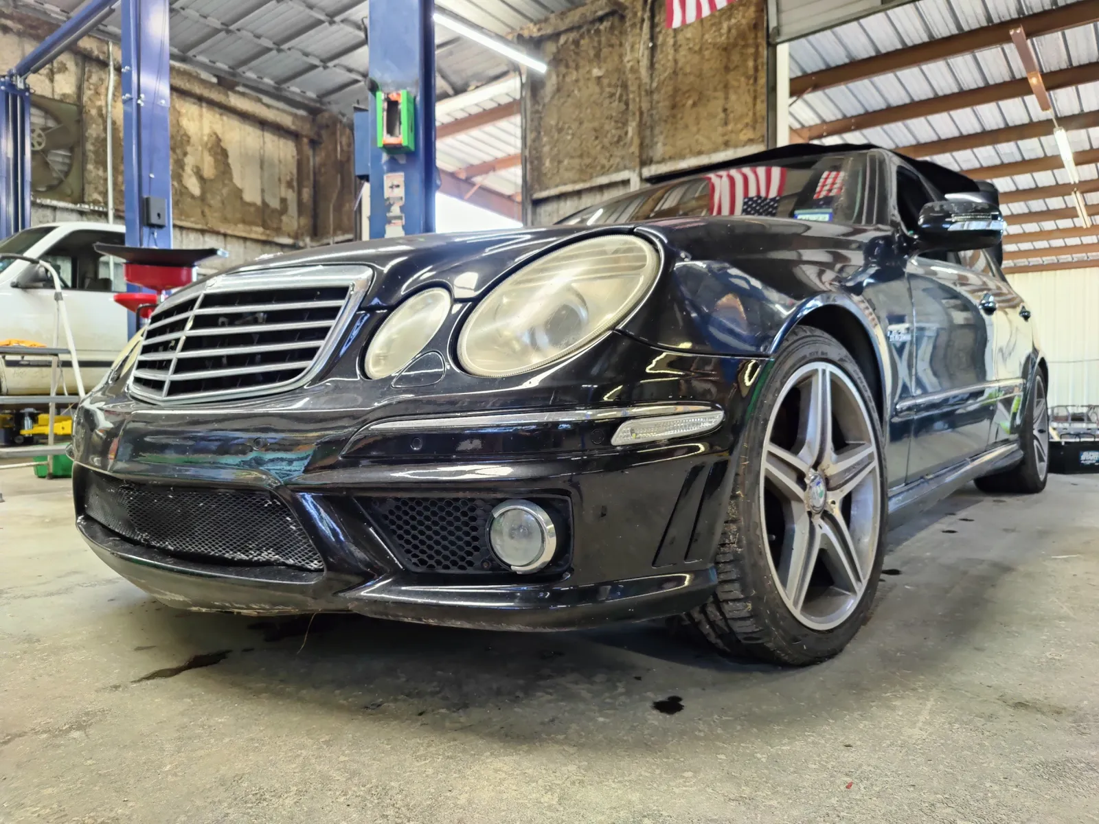 Black Mercedes-Benz E63 AMG in the service bay
