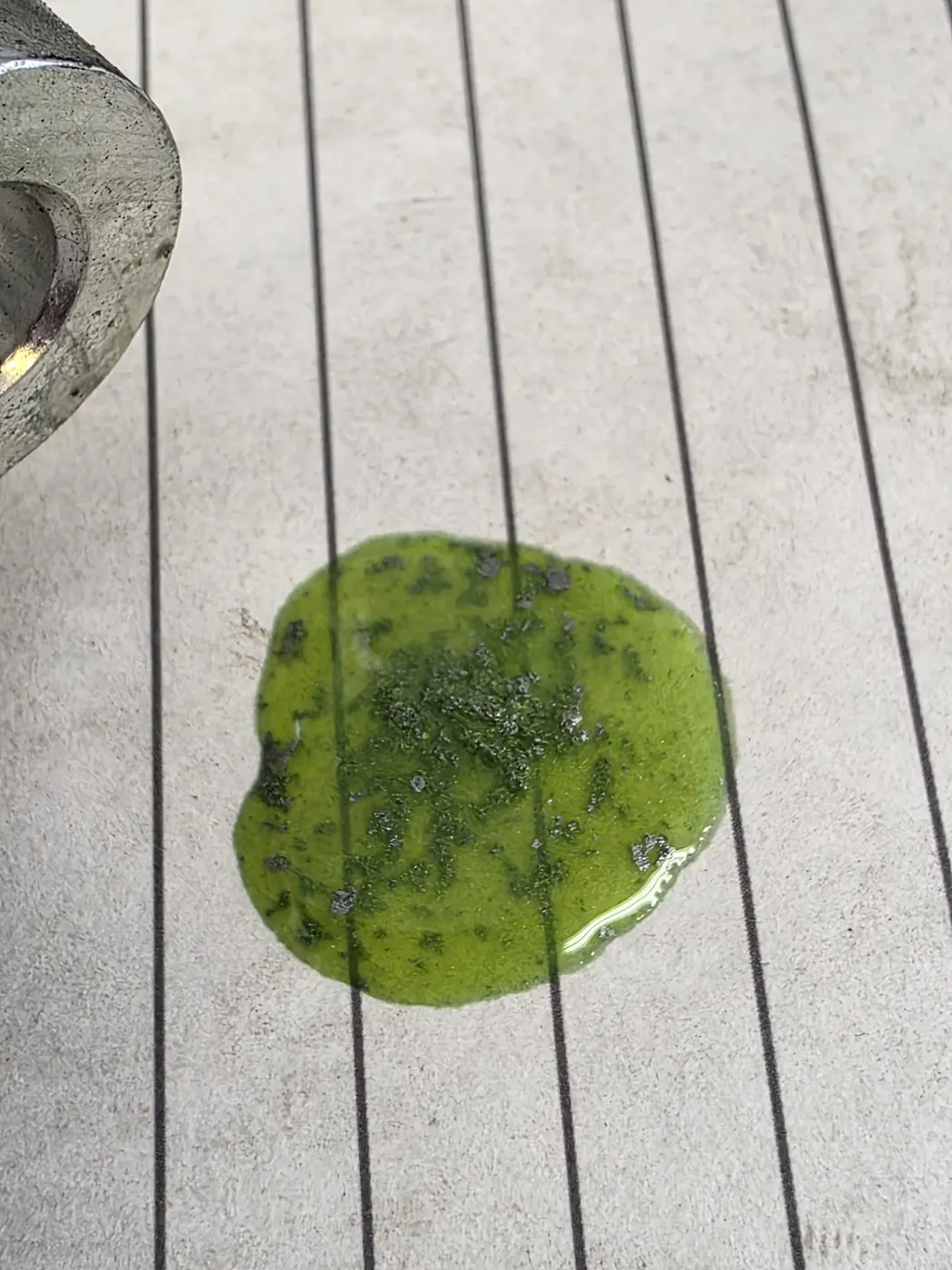 Sludgy, contaminated coolant drained onto the floor